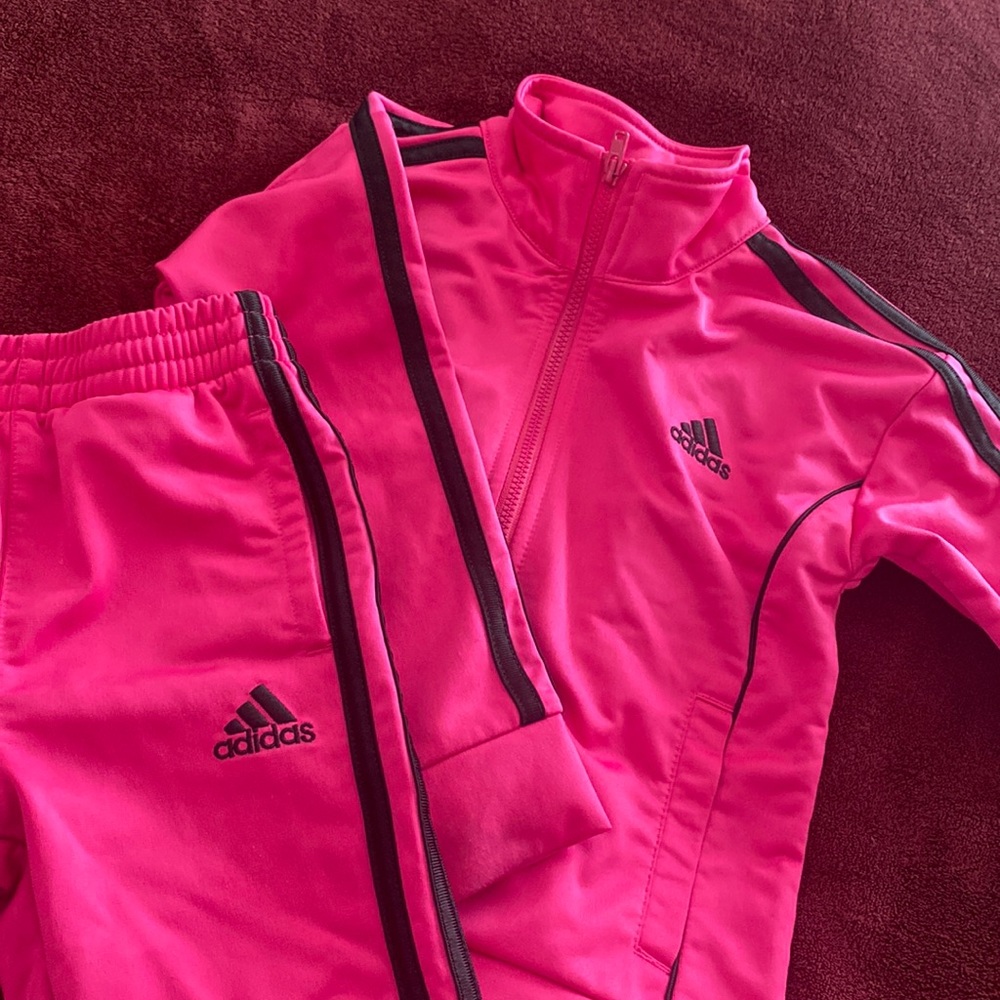 2T zip front pink and black cuffs have a little stains
